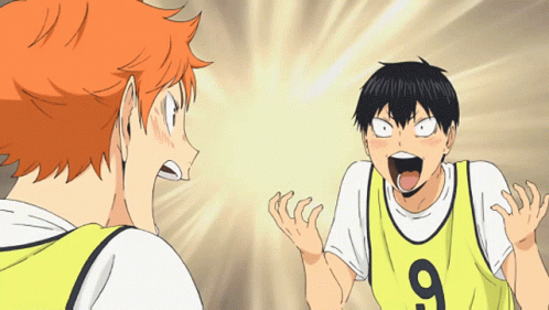A Man Wearing A Yellow Jersey With The Number 9 On It Stands Next To Another Man GIF