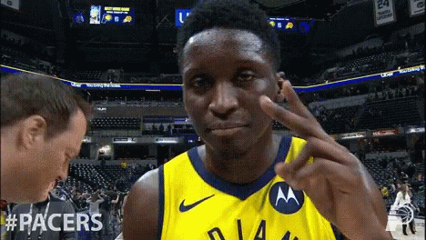 A Man Wearing A Yellow Jersey With The Word Racers On The Front GIF