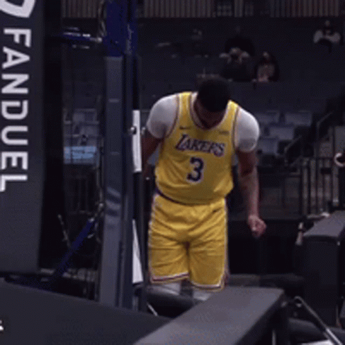 A Man Wearing A Yellow Lakers Jersey With The Number 3 GIF