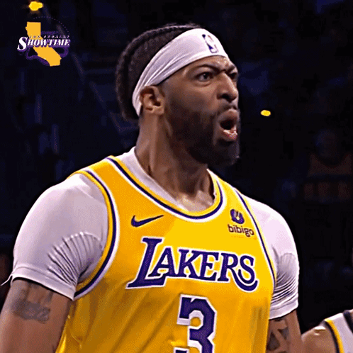 A Man Wearing A Yellow Lakers Jersey With The Number 3 GIF