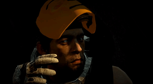A Man Wearing A Yellow Mask With A Smile On It GIF