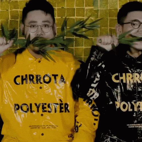 A Man Wearing A Yellow Shirt That Says Chrrota Polyester GIF