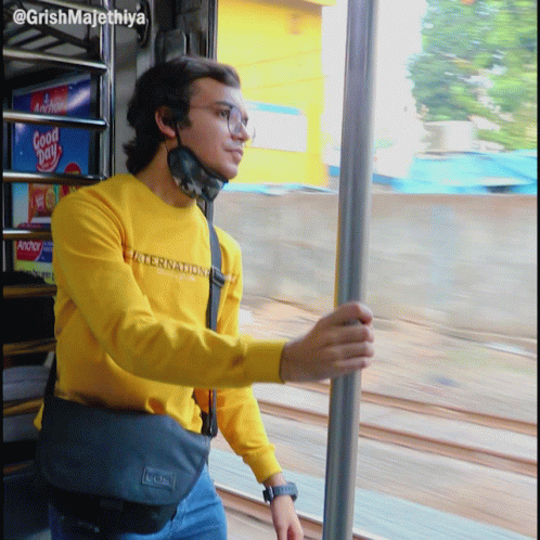 A Man Wearing A Yellow Shirt That Says International GIF