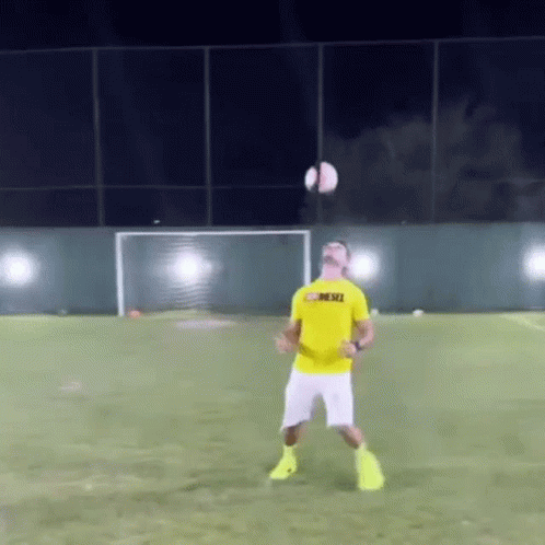 A Man Wearing A Yellow Shirt That Says Mesci GIF