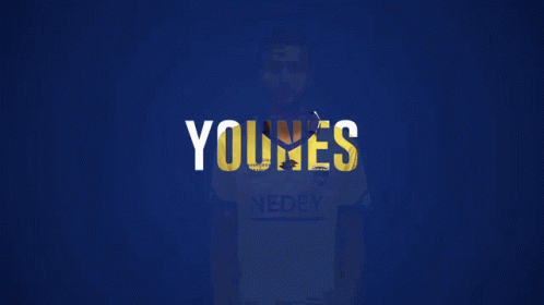 A Man Wearing A Yellow Shirt That Says Nedey On It GIF