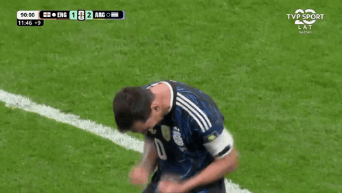 A Man Wearing A Yellow Vest With The Number 8 On It Stands On A Soccer Field GIF