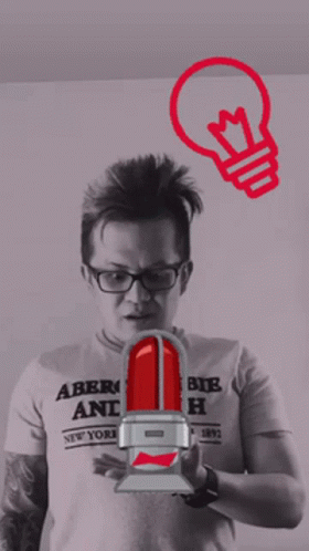 A Man Wearing An Abercrombie And Fitch Shirt Holds A Light Bulb GIF