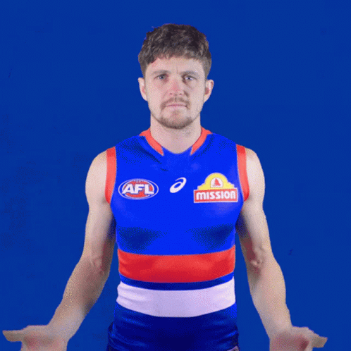 A Man Wearing An Afl Jersey With Mission Written On The Front GIF