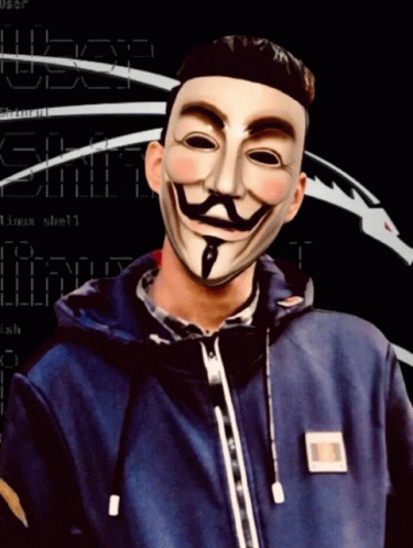 A Man Wearing An Anonymous Mask Stands In Front Of A Screen That Says ' User ' On It GIF