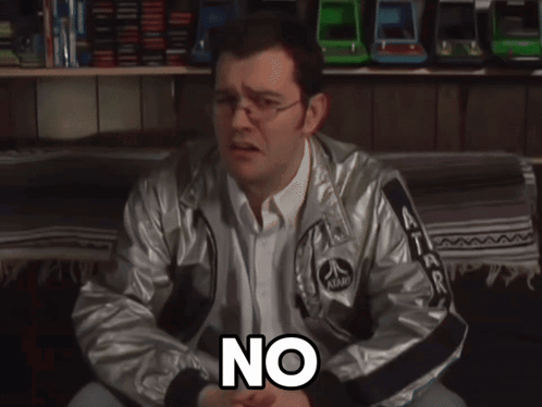A Man Wearing An Atari Jacket Is Sitting On A Couch And Says It 'S Not True GIF