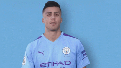 A Man Wearing An Etihad Airways Jersey Smiles For The Camera GIF