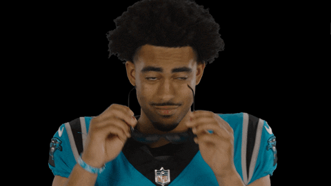 A Man Wearing An Nfl Jersey And Sunglasses GIF
