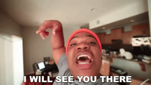 A Man Wearing An Orange Beanie Says I Will See You There GIF