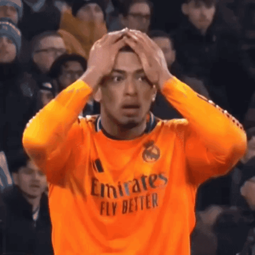 A Man Wearing An Orange Emirates Fly Better Jersey GIF