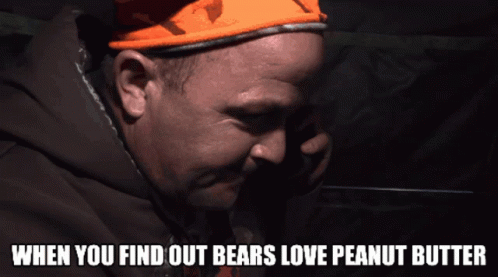A Man Wearing An Orange Hat With The Words When You Find Out Bears Love Peanut Butter GIF