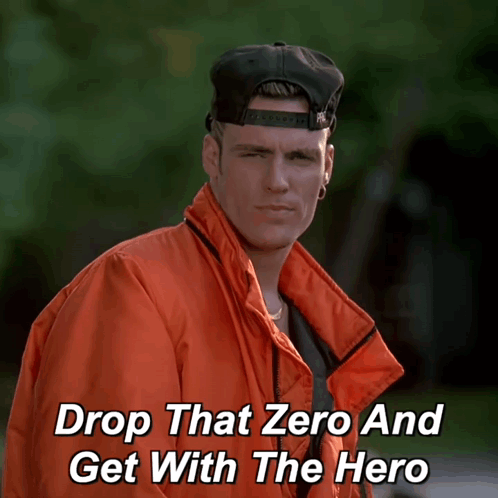 A Man Wearing An Orange Jacket And A Black Hat With The Words Drop That Zero And Get With The Hero Below Him GIF