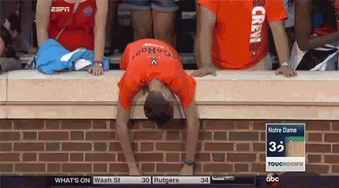 A Man Wearing An Orange Shirt That Says Crew On It GIF