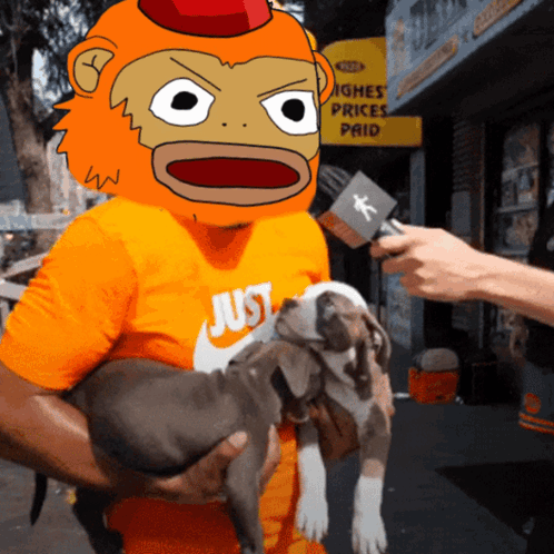 A Man Wearing An Orange Shirt That Says Just Holds A Puppy GIF