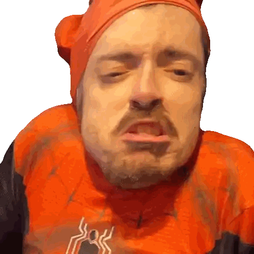 a man wearing an orange shirt with a spider web on it