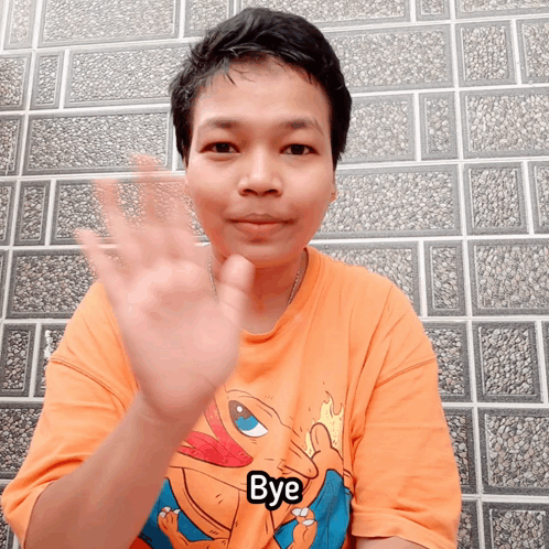 A Man Wearing An Orange Shirt With The Word Bye On It GIF