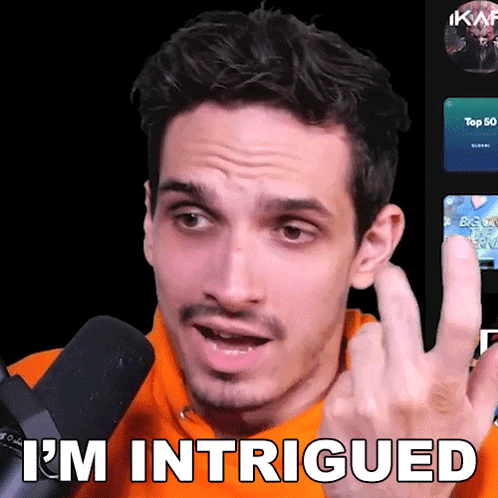 A Man Wearing An Orange Sweatshirt Says I 'M Intrigued GIF
