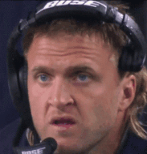 A Man Wearing Bose Headphones Is Making A Funny Face . GIF