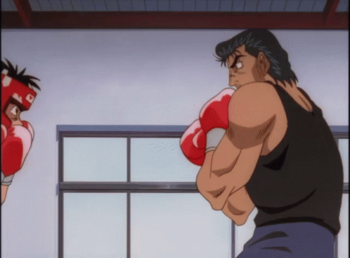 A Man Wearing Boxing Gloves And A Helmet With The Letter R On It GIF