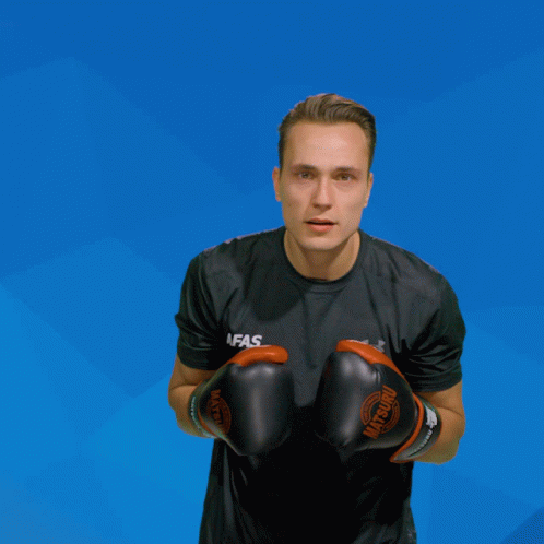A Man Wearing Boxing Gloves That Say Afas GIF