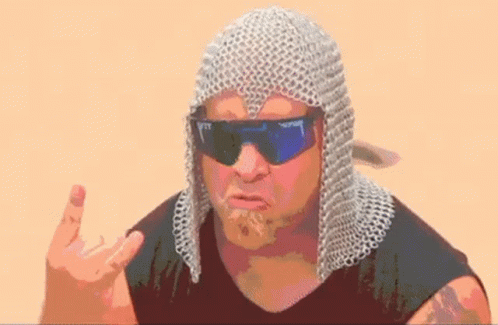 A Man Wearing Chain Mail And Sunglasses Is Making A Funny Face And Giving The Middle Finger . GIF