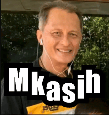A Man Wearing Ear Buds And A Shirt That Says ' M Kasih ' On It GIF