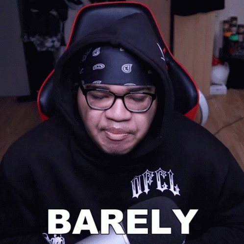 A Man Wearing Glasses And A Bandana Has Barely Written On His Face GIF