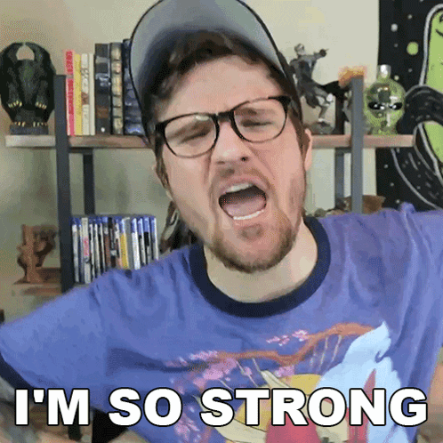 A Man Wearing Glasses And A Baseball Cap Says I 'M So Strong GIF