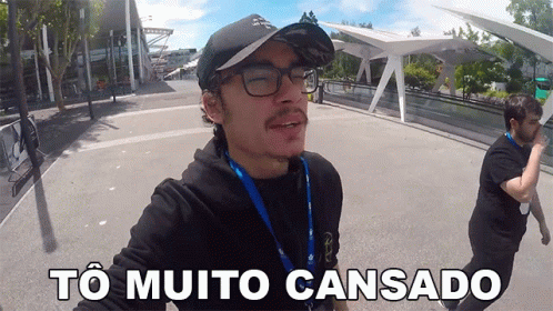 A Man Wearing Glasses And A Baseball Cap Says " To Muito Cansado " GIF