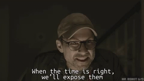 A Man Wearing Glasses And A Baseball Cap Says When The Time Is Right We 'Ll Expose Them GIF
