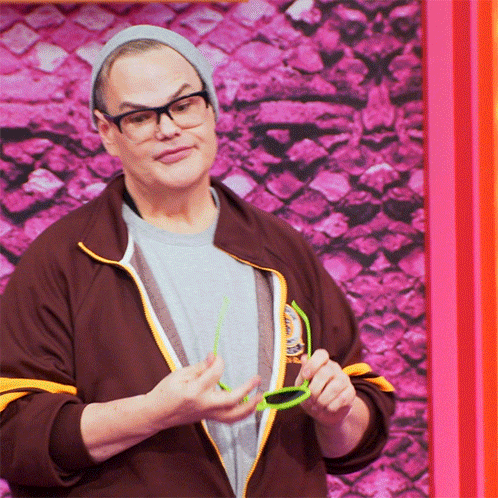 Man With Glasses And Beanie Holding Green Glasses GIF