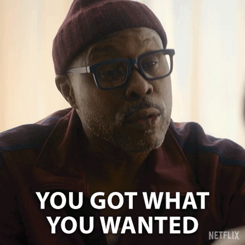 A Man Wearing Glasses And A Beanie Says You Got What You Wanted GIF