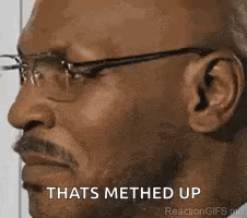 A Man Wearing Glasses And A Beard Is Making A Funny Face And Says `` Thats Methed Up '' . GIF