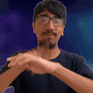 A Man Wearing Glasses And A Beard Is Making A Gesture With His Hands GIF