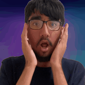 A Man Wearing Glasses And A Beard Is Making A Surprised Face GIF