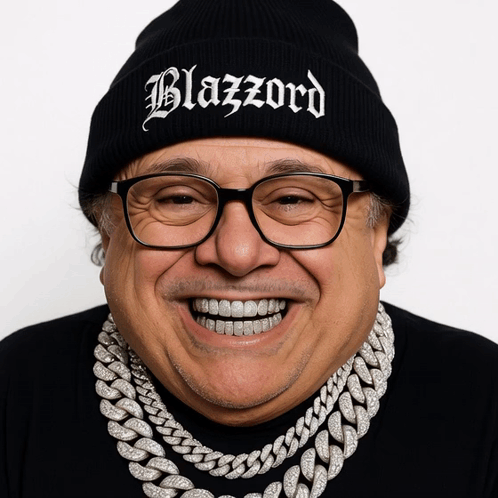 A Man Wearing Glasses And A Black Beanie That Says Blazzard GIF