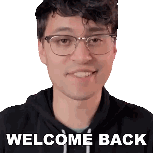 a man wearing glasses and a black hoodie with the words welcome back on the front