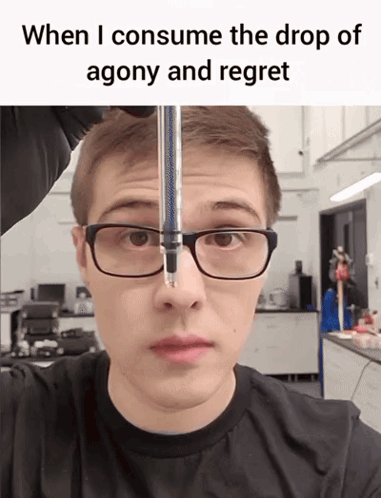 A Man Wearing Glasses And A Black Shirt Is Looking At A Drop Of Agony And Regret GIF