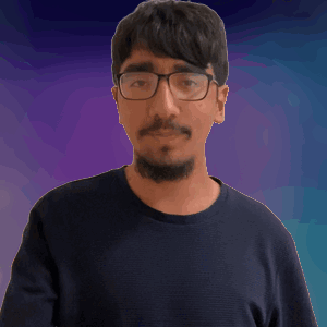A Man Wearing Glasses And A Black Shirt Is Making A Fist GIF