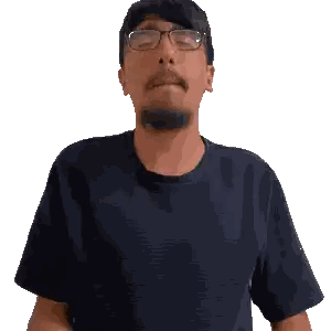 a man wearing glasses and a black shirt is making a gesture with his hands