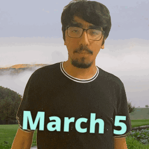 A Man Wearing Glasses And A Black Shirt Says March 5 GIF