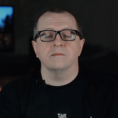 A Man Wearing Glasses And A Black Shirt Says Motion Sickness The GIF