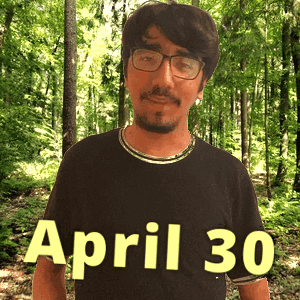 A Man Wearing Glasses And A Black Shirt That Says April 30 On It GIF