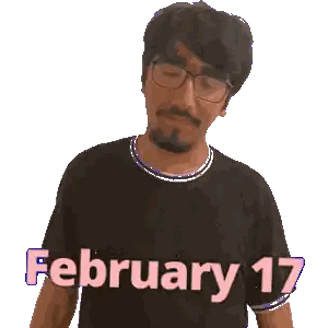 a man wearing glasses and a black shirt that says february 17 on it