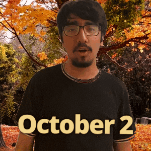 A Man Wearing Glasses And A Black Shirt That Says October 2 On It GIF