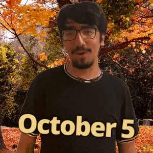 A Man Wearing Glasses And A Black Shirt That Says October 5 On It GIF